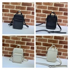 Gucci Knockoff 658553 LuXury GG embossed mini bag in blackwhite leather